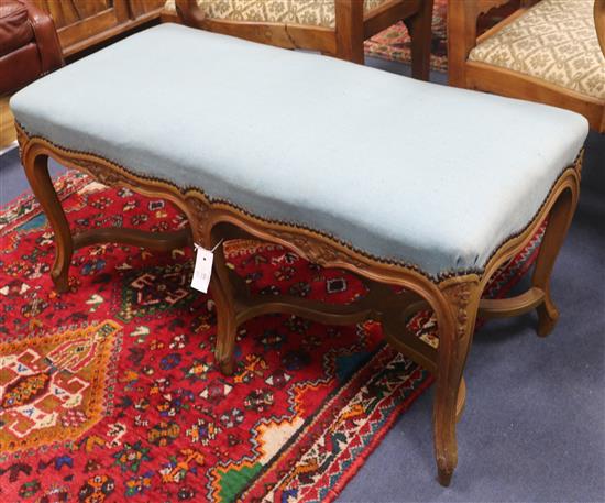 An 18th century style beech framed stool, W.95cm